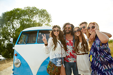 Image showing hippie friends over minivan car showing peace sign