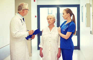 Image showing medics and senior patient woman at hospital