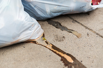 Image showing close up of rubbish bags with trash outdoors