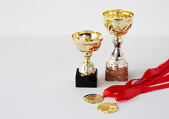 Image showing close up of sports golden cups and medals