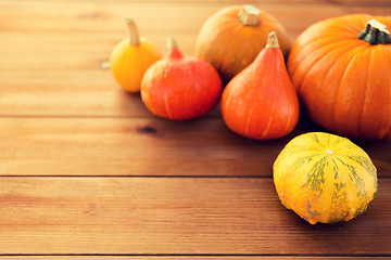 Image showing close up of pumpkins on wooden table at home