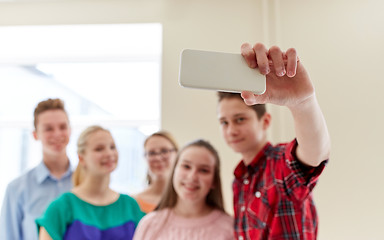 Image showing group of students taking selfie with smartphone