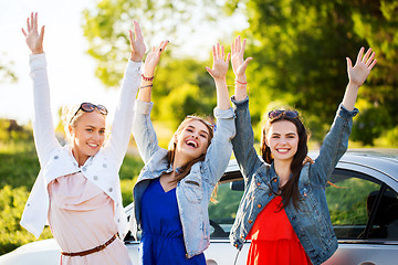 Image showing happy teenage girls or women near car at seaside