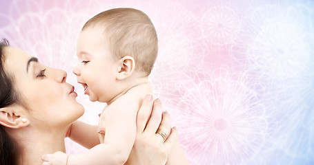 Image showing happy mother kissing adorable baby