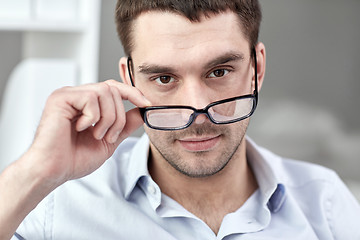 Image showing portrait of businessman in eyeglasses at office