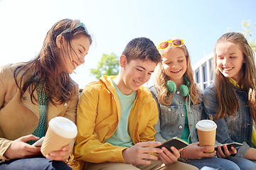 Image showing teenage friends with smartphone and coffee cups