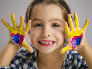 Image showing Little girl with hands in paint