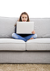 Image showing Little girl working with a laptop