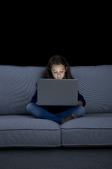 Image showing Little girl working with a laptop