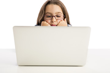 Image showing Little girl working with a laptop