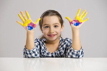 Image showing Little girl with hands in paint