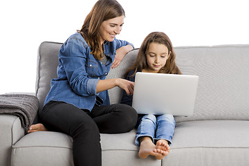 Image showing Mother teaching her little daughter