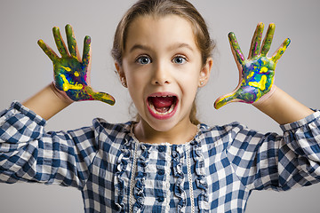 Image showing Little girl with hands in paint