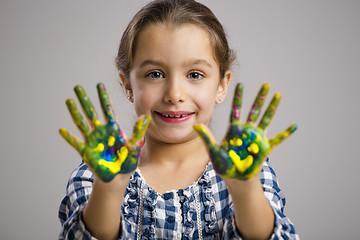 Image showing Little girl with hands in paint