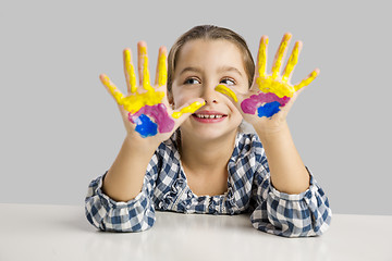 Image showing Little girl with hands in paint