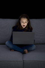 Image showing Little girl working with a laptop