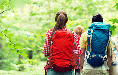 Image showing close up of friends with backpacks hiking