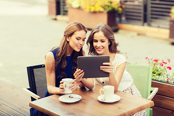 Image showing young women with tablet pc and coffee at cafe
