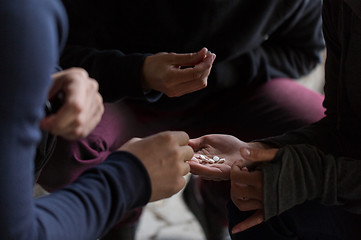 Image showing close up of addicts using drug pills