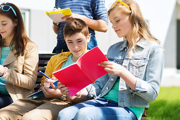 Image showing group of students with notebooks at school yard