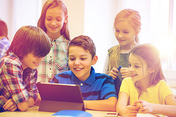 Image showing group of school kids with tablet pc in classroom