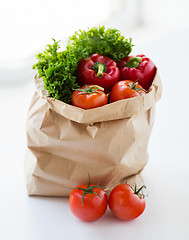 Image showing close up of paper bag with vegetables and greens