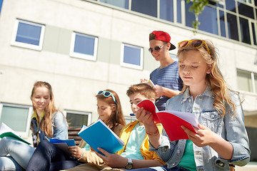 Image showing group of students with notebooks at school yard