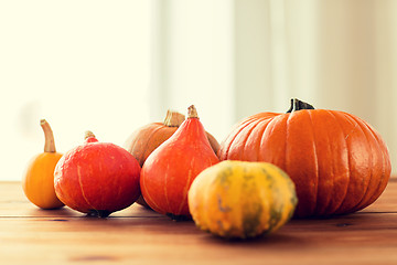 Image showing close up of pumpkins on wooden table at home