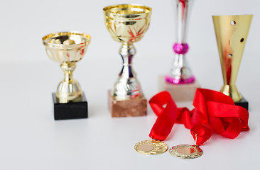 Image showing close up of sports golden cups and medals