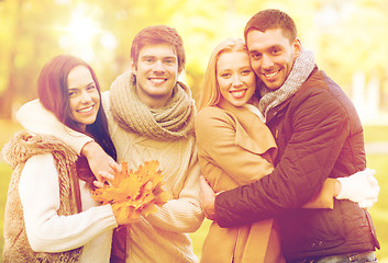 Image showing group of friends having fun in autumn park