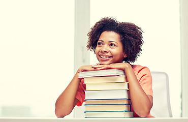 Image showing happy african student girl with books at home