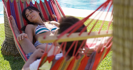 Image showing Young holiday couple relaxing in a hammock