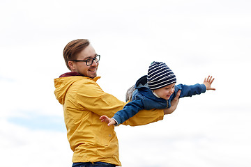 Image showing father with son playing and having fun outdoors