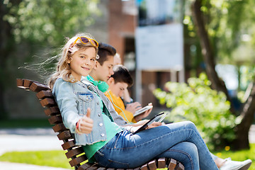 Image showing happy girl with tablet pc computer outdoors