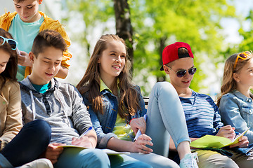 Image showing group of students with notebooks at school yard