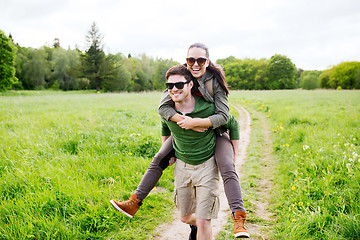 Image showing happy couple with backpacks having fun outdoors