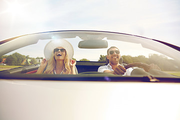 Image showing happy man and woman driving in cabriolet car