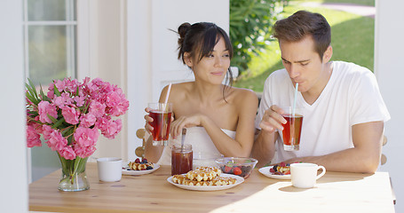 Image showing Couple drinking iced tea at breakfast outside