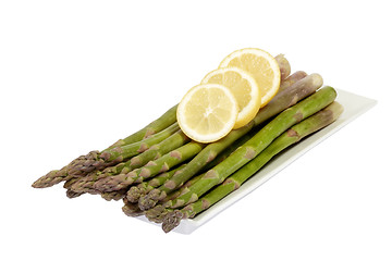 Image showing Asparagus with lemon slices