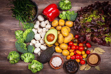 Image showing Assorted raw vegetables on wooden background