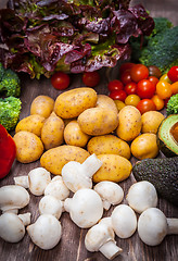 Image showing Assorted raw vegetables on wooden background