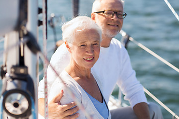 Image showing senior couple hugging on sail boat or yacht in sea