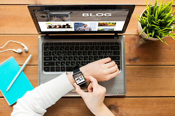 Image showing close up of woman with smart watch and laptop