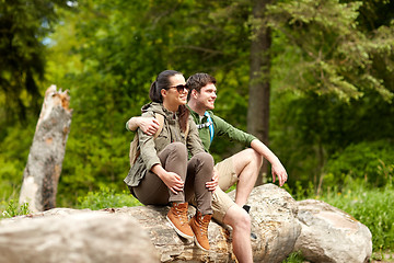 Image showing smiling couple with backpacks in nature