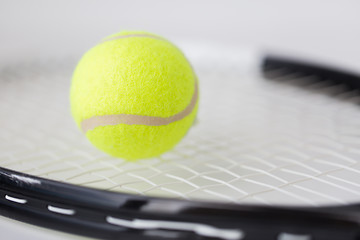 Image showing close up of tennis racket with ball