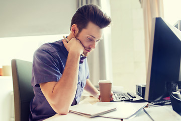 Image showing creative male office worker with coffee thinking