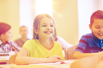 Image showing group of school kids writing test in classroom