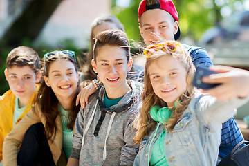 Image showing happy teenage students taking selfie by smartphone