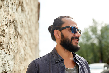 Image showing happy smiling man with beard on city street