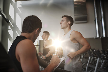 Image showing men exercising on treadmill in gym